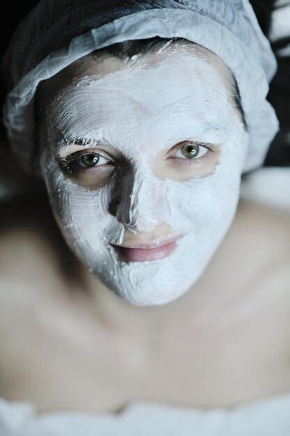 Premium Photo Young Beautiful Woman Receiving Cosmetic Facial Mask In