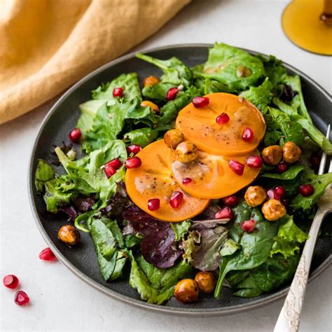 Persimmon Pomegranate Salad With Candied Hazelnuts Garlic And Zest