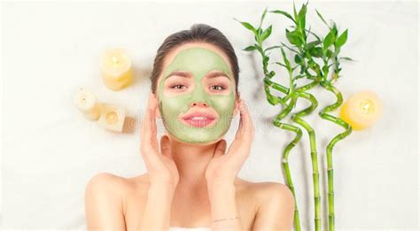 Spa Woman Applying Facial Green Clay Mask Beauty Treatments Close Up