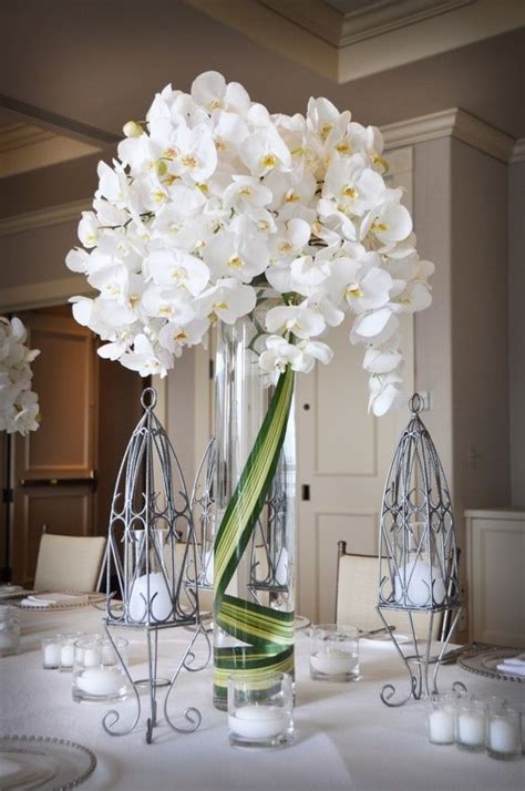 See your favorite silk orchids wedding and white silk orchid heads discounted & on sale. Love the single leaf greenery in the vase. | White flower ...