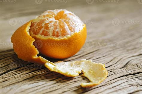 Mandarin Orange Peeled Half On Wood Background 2502126 Stock Photo At