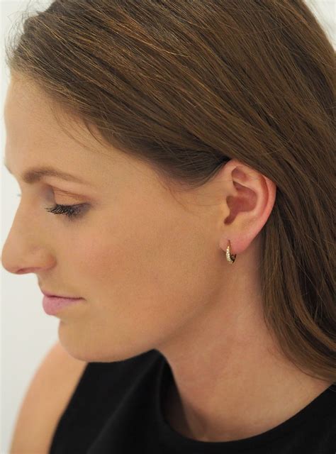 These earrings are a beautiful and safe option for children and can prevent hair & fabric from getting caught on the earring. Gigi Huggie Cz Hoop Earrings in Gold — Jewellery Co. Australia