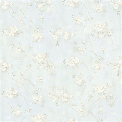 A Blue And White Wallpaper With Flowers On It