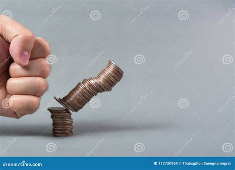 Hand Punch The Increasing Columns Of Coins On White Background Stock