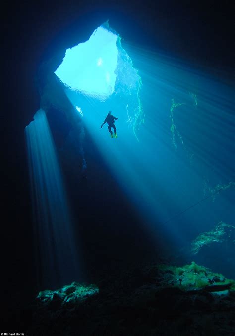 Spectacular Images Of Divers Exploring Water Filled Cavern Hidden