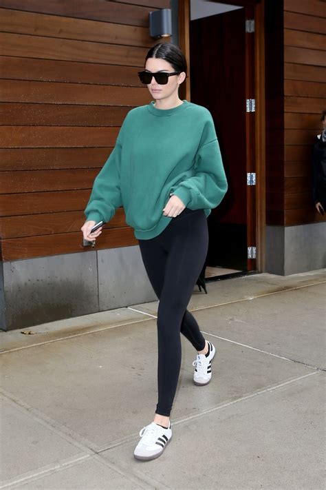 Kendall Jenner Wearing Black Leggings And A Green Sweatshirt In Nyc