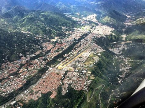An Aerial View Of A Small Town In The Mountains