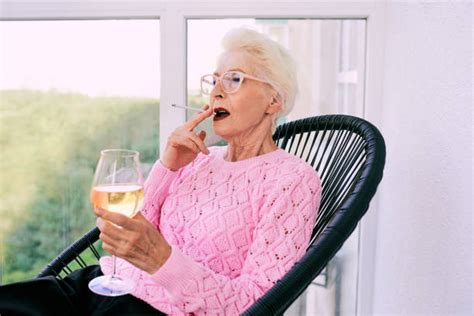 Old Lady Smoking Cigarette Pics Stock Photos Pictures And Royalty Free