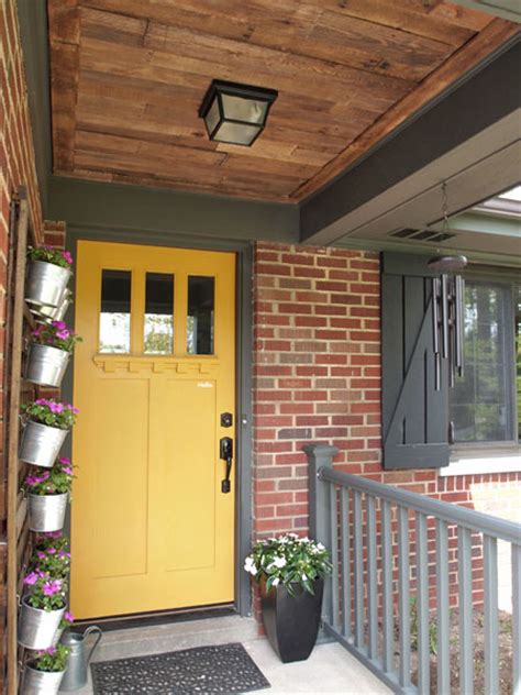 No matter what look you're going for — bright reds, stained woods, or monochromatic frames — these ideas show just how easily a can of paint (and a free afternoon!) can transform your home's exterior. Yellow front doors! - Front Door Freak