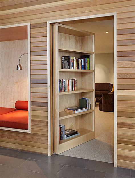 It's certainly hard to notice the difference between a regular bookshelf and one that leads you to a totally different room. Three Ways To Introduce The Bookshelf Doorway To Your Home