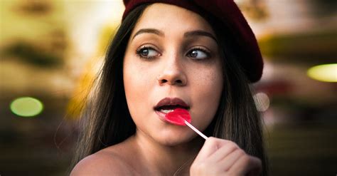 Selective Photography Of Woman Putting Lollipop In Her Mouth · Free