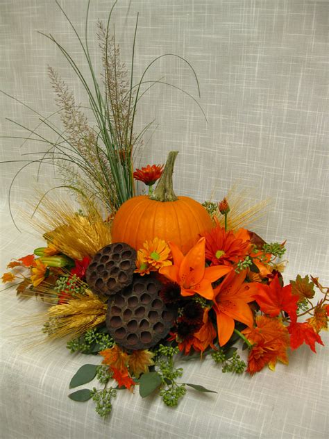 Fall Centerpiece With A Pumpkin In The Middle Fall Floral