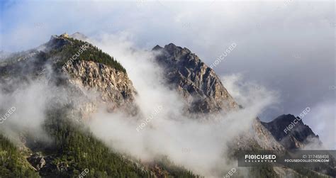 Clouds Gather Around Rocky Mountain Peaks Field British Columbia