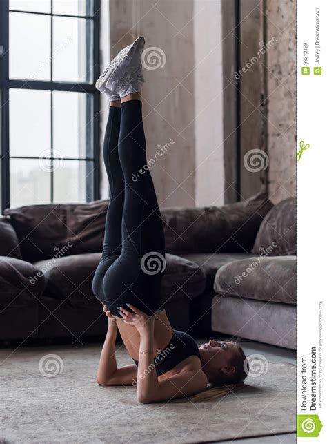 A category of gymnastics that includes all of the events. Athletic Girl Doing Supported Shoulder Stand During Yoga Or Gymnastics Practice At Home Stock ...