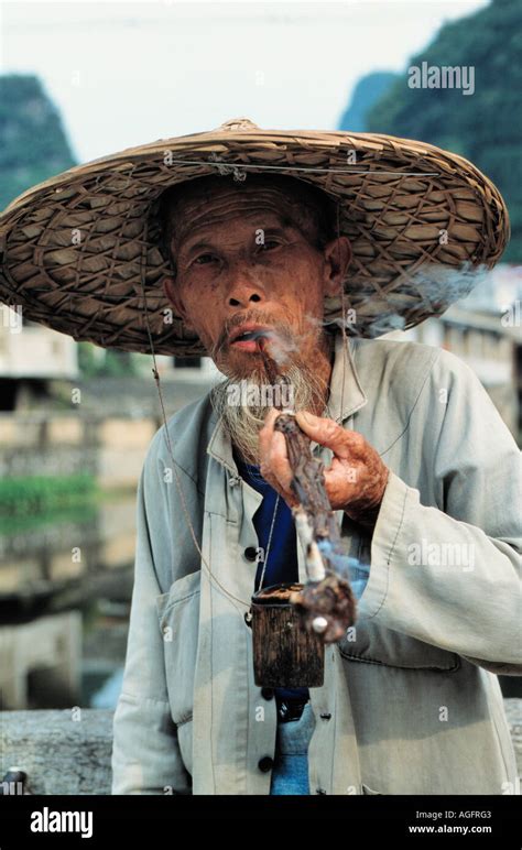 Old Man Smoking Pipe Yangshuo China Stock Photo Alamy