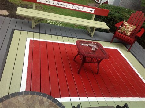 Linda took her front porch from worn and tired to a charming place that turns heads. Painted rug! | Painted porch floors, Painted patio, Deck paint