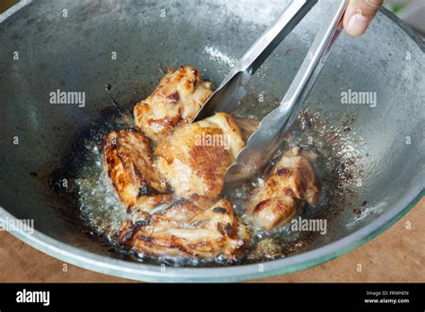 Fried Chicken Cooking In An Iron Skillet Stock Photo Alamy