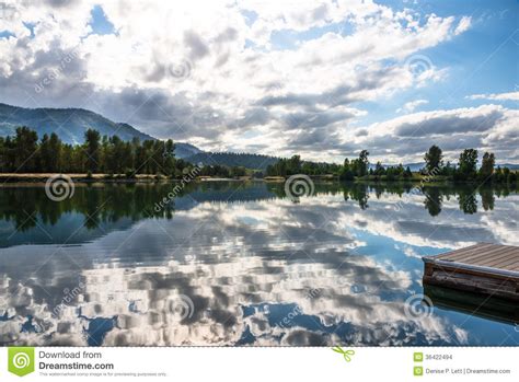 Water Reflection Clouds Trees Boat Dock Stock Photo Image Of America