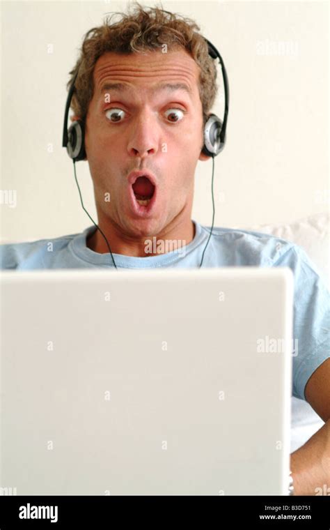 Man Using Laptop Computer Looking Shocked Stock Photo Alamy