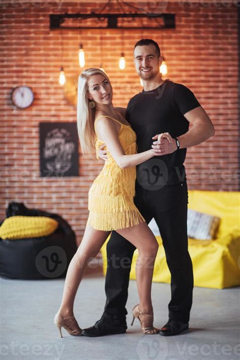 Young Couple Dancing Latin Music Bachata Merengue Salsa Two Elegance Pose On Cafe With Brick