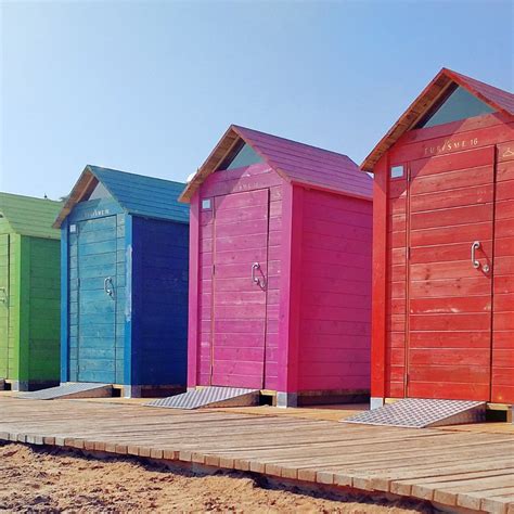 There Is Something Fun About The Colorful Beach Huts That Line The