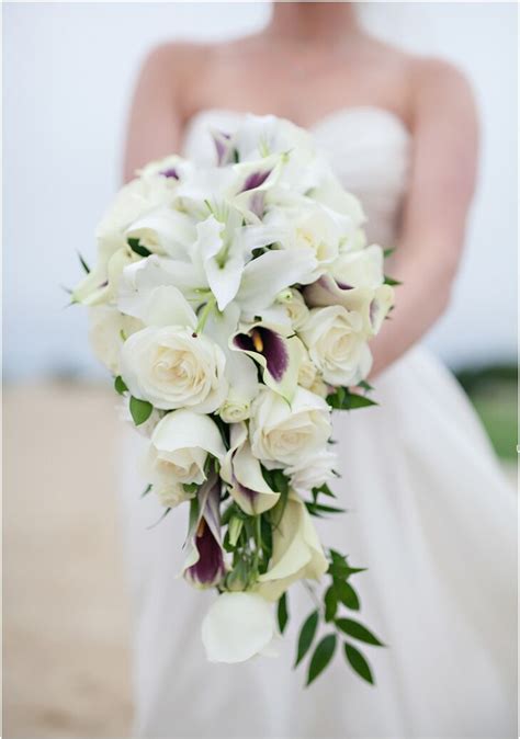 A cascading flower arrangement is dramatic and beautiful, making it perfect for a bridal bouquet. Cascading Rose and Calla Lily Bridal Bouquet