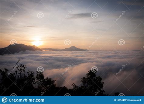 Mountain With White Mist In Morning Sunrise Nature Landscape Stock
