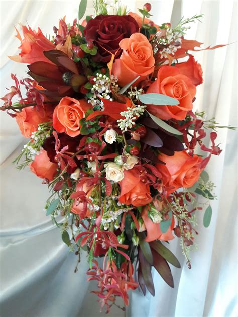 A Stunning Autumn Cascade In Burgundy And Coral Coral Bouquet