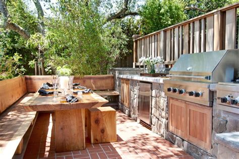 The deck was already covered, which is perfect for protecting the appliances from harsh weather and the wooden flooring is extremely simple to care for. Outdoor Kitchen Ideas - Transitional - deck/patio ...