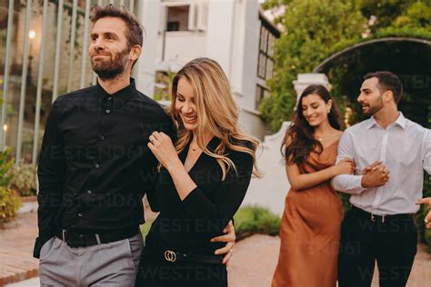 Two Happy Young Couples Going On A Double Date Together In The Evening Two Romantic Young