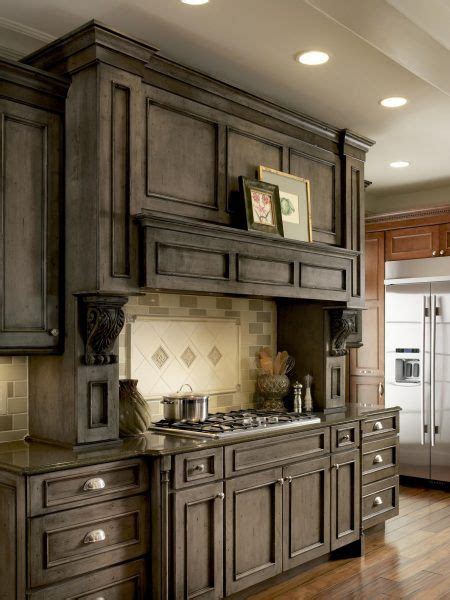This classic kitchen by cabinets.com designer sheila pairs our light gray stain with unique and aged finishes for a decidedly rustic feel. Medallion Cabinetry | Devonshire | Stained kitchen ...