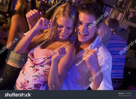 Young Man Young Woman Dancing Nightclub Stock Photo 13940902 Shutterstock