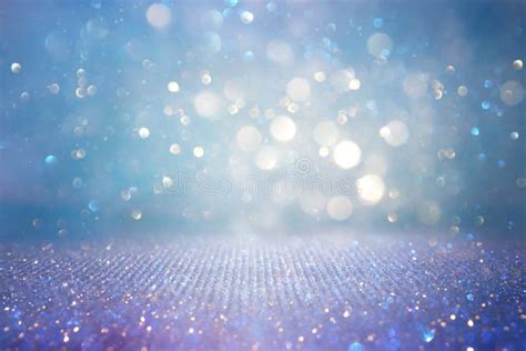 Abstract Glitter Silver Gold Blue Lights Background De Focused