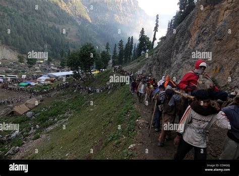 Kashmiri Muslim Porters Carry Hindu Pilgrims On The Palanquins To The Amarnath Cave Shrine Near