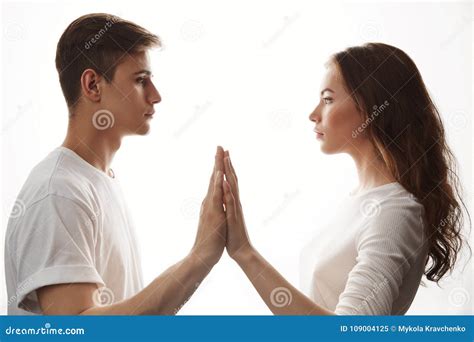 Couple In Love Looking At Each Other In White Room Man And Woman Holding Hands Showing That