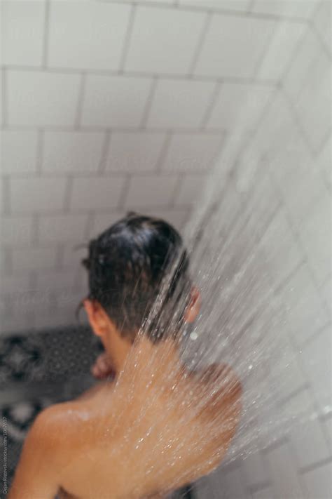Boy Under Shower Taking A Bath By Dejan Ristovski