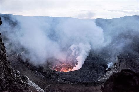 Mount nyiragongo is an active stratovolcano with an elevation of 3,470 m (11,385 ft) in the virunga mountains associated with the albertine rift.it is located inside virunga national park, in the democratic republic of the congo, about 20 km (12 mi) north of the town of goma and lake kivu and just west of the border with rwanda.the main crater is about two kilometres (1 mi) wide and usually. How to Hike Congo's Mount Nyiragongo, an Active Volcano