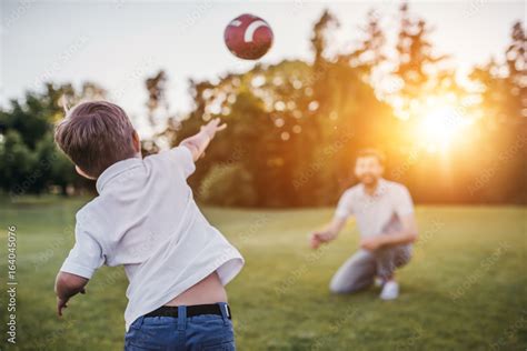 Dad With Son Playing American Football Stock Photo Adobe Stock