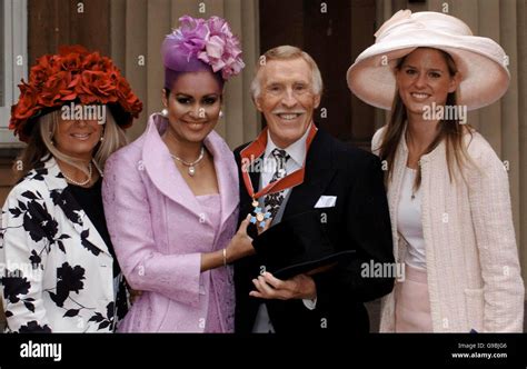 entertainer bruce forsyth with his wife wilnelia and daughters julie purdie left and louisa