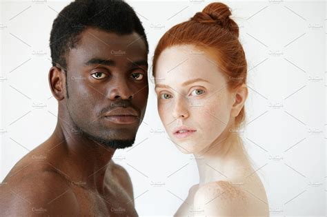 Close Up Portrait Of Black Man And White Woman Standing Isolated