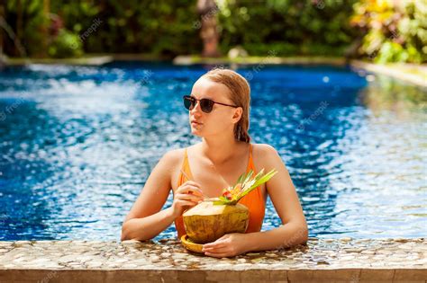 premium photo expressive beautiful woman posing in the swimming pool