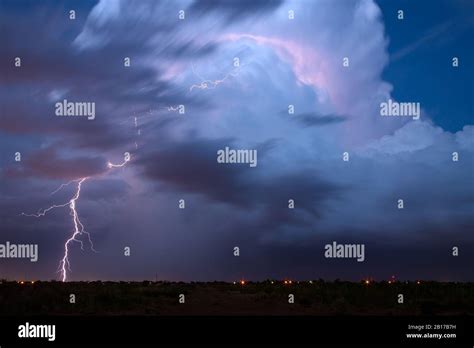 Dramatic Cumulonimbus Cloud And Lightning Bolt Strike In A Severe