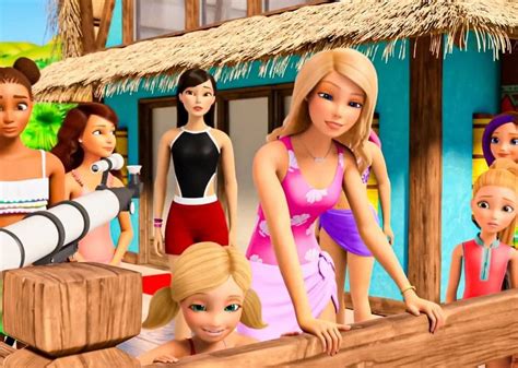Barbie Dolls Are Standing On The Deck Of A Beach House With People In