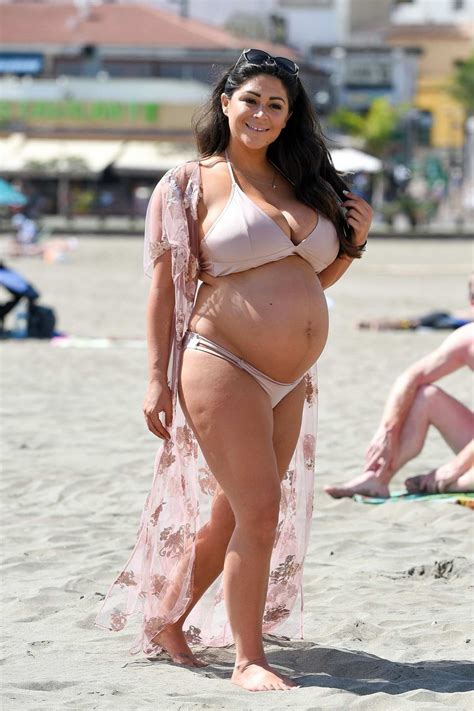 Casey Batchelor Shows Off Her Baby Bump In A Pastel Pink Bikini While