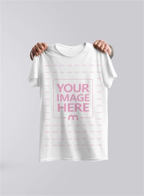 A Creative Mockup Template With Hands Holding A T Shirt In The Air