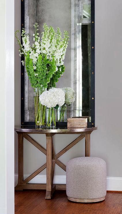 She used a glaze and dry brush combo. Ballard Designs Zinc Framed Mirror - Modern House