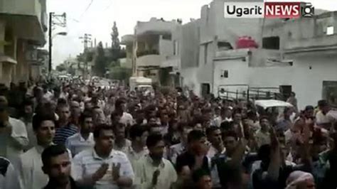 syria thousands protest in restive city of hama bbc news