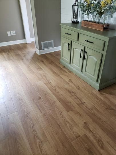 Then, starting in the far corner of the room, lay the first tile down against the wall, removing the tongue so it's flush with the wall. Pergo Outlast+ Waterproof Marigold Oak 10 mm T x 7.48 in. W x 47.24 in. L Laminate Flooring (549 ...