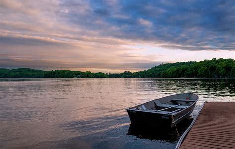 Rowboat Docked In A Lake At Sunset Photograph By John Twynam Fine Art