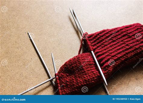 Unfinished Knitting Wool And Knitting Needles Project Red Thread And